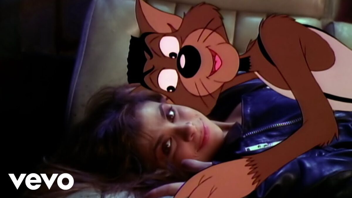 Paula Abdul with a cartoon wolf on top of her