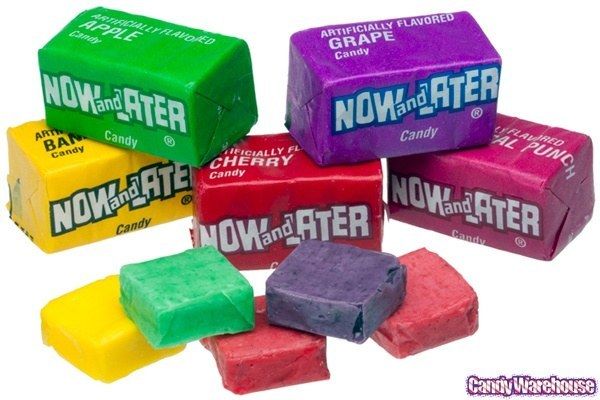 Different flavors of now and later candy in and out of the wrappers.
