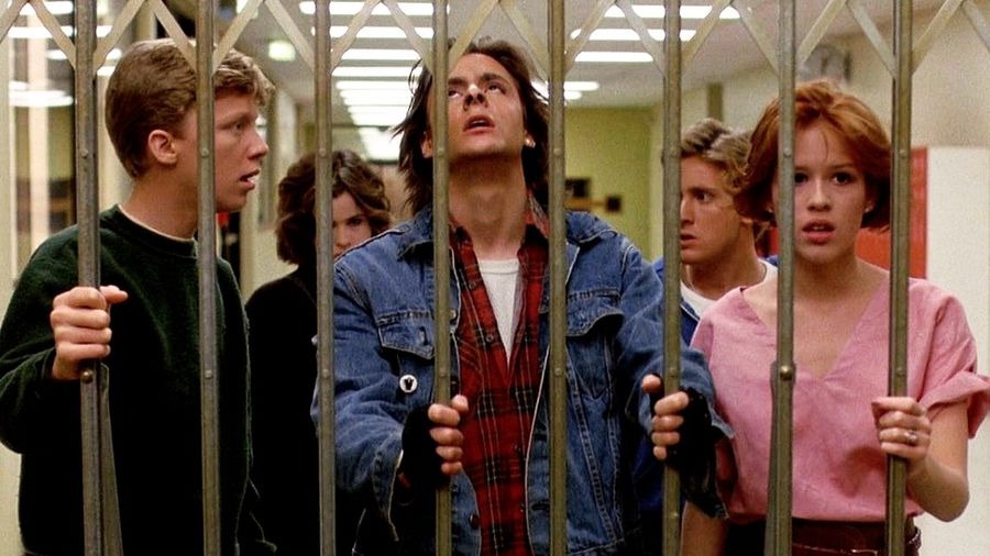 The main actors from the breakfast club meet up with a metal gate.